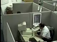 Office worker hits and kicks computer meme template